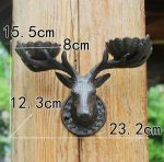 Accessoire mural en fonte, bougeoir cerf élégant