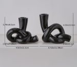 Bougeoir noir stylé avec motifs de nœud