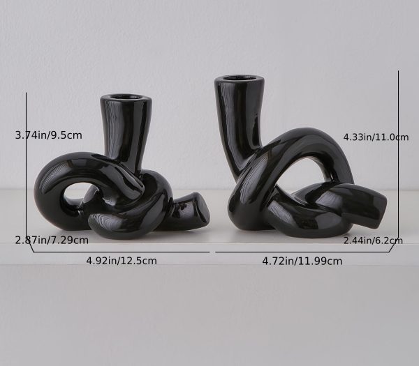 Bougeoir noir stylé avec motifs de nœud