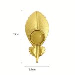 Bougeoir en métal, charme de la plume dorée