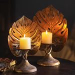 Bougeoir doré au design tropical pour une ambiance chaleureuse