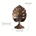 Bougeoir doré au motif tropical, idéal pour événements festifs