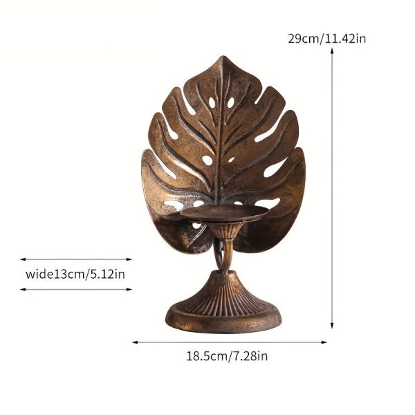 Bougeoir doré au motif tropical, idéal pour événements festifs