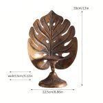 Élégant bougeoir doré, touche tropicale pour votre intérieur