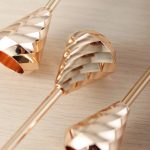 Lustre en fonte, finition Champagne Gold