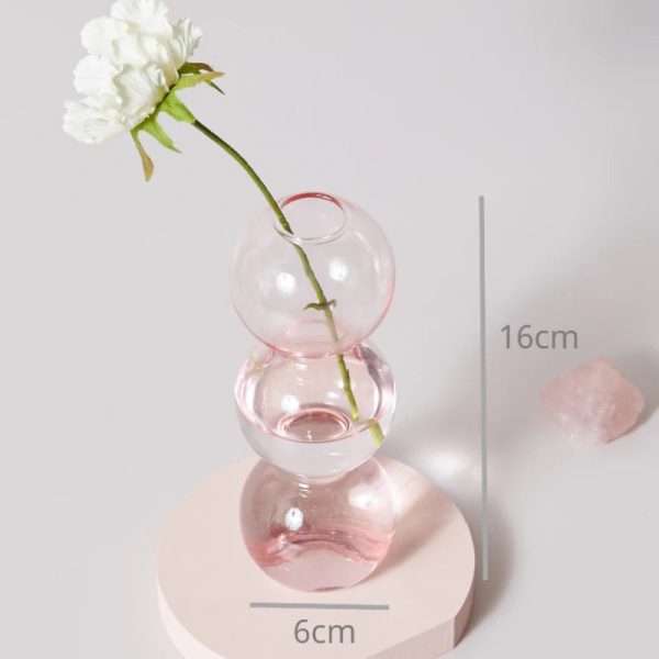 Chandelier en verre rose, idéal pour des soirées cosy
