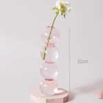 Bougeoir en verre rose, accent décoratif subtil