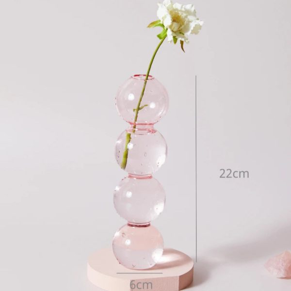 Bougeoir en verre rose, accent décoratif subtil