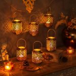 Ensemble de deux lumignons en fonte dorée, style chic