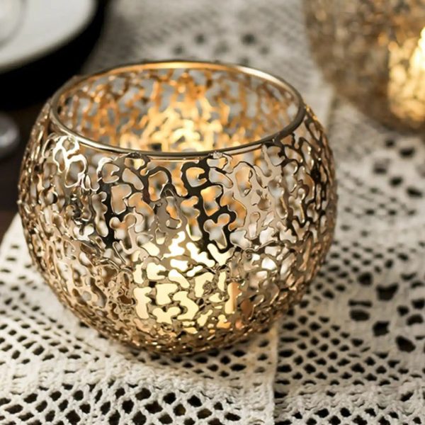 Photophore en fonte dorée, design boule élégant