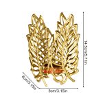 Élément de décoration en métal avec finition dorée