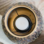 Élégant photophore noir, idéal pour création d'atmosphère chaleureuse