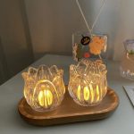 Photophore en verre de forme tulipe pour ambiance chaleureuse